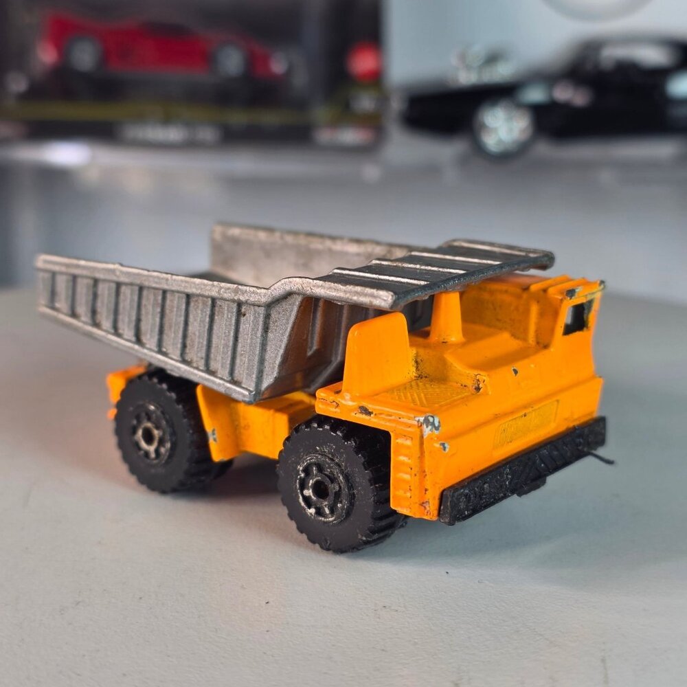 Vintage 1989 Matchbox Dump Truck Orange Silver Bed Patina Loose